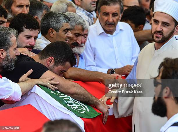 Relatives and friends mourn at the funeral service for victims of the thwarted coup in Istanbul at Fatih mosque in Istanbul, July 17 Turkey. Clean up...