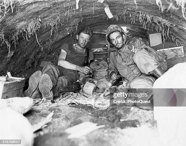 Marine Corps motion picture cameramen Sgt WA Genaust and Corporal Atlee S Tracy, Iwo Jima, February 24, 1945. Genaust was the cameraman who filmed in...