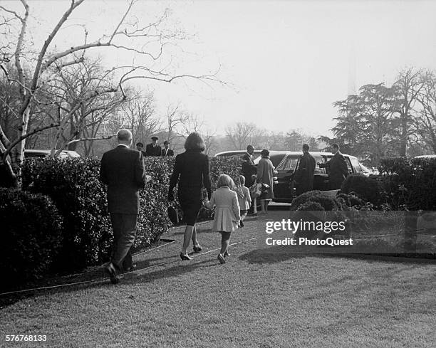 Jacqueline and Caroline Kennedy hold hands as they exit the White House for the last time as residents, Washington DC, December 6, 1963. John F...