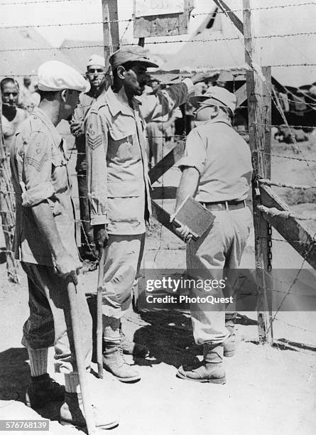 Arab POWs captured by the Israeli Army in their advance across Palestine are held at this camp where an Arab camp police force has been established...