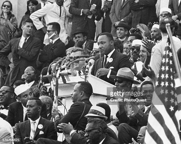 American Religious and Civil Rights leader Dr Martin Luther King Jr addresses the crowd on the steps of the Lincoln Memorial during the March on...