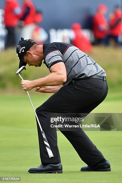 Henrik Stenson of Sweden celebrates on the 18th green after holing a putt for victory during the final round on day four of the 145th Open...