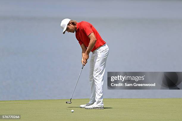 Aaron Baddeley of Australia putts on the third green during the final round of the Barbasol Championship at the Robert Trent Jones Golf Trail at...