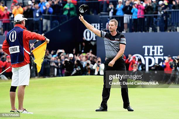 Henrik Stenson of Sweden celebrates on the 18th green after holing a putt for victory during the final round on day four of the 145th Open...