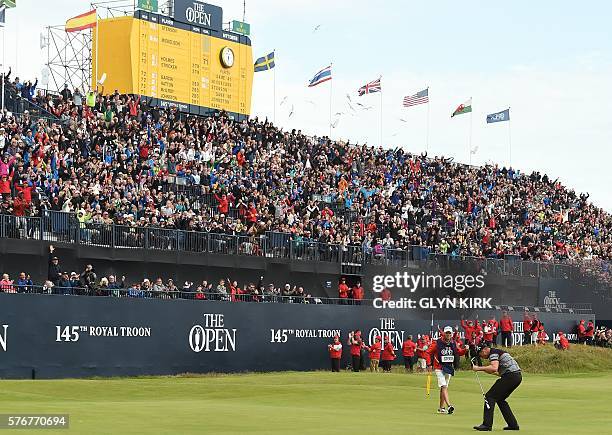 Winner, Sweden's Henrik Stenson reacts after making his birdie putt on the 18th green during his final round 63 to win the Championship, on day four...