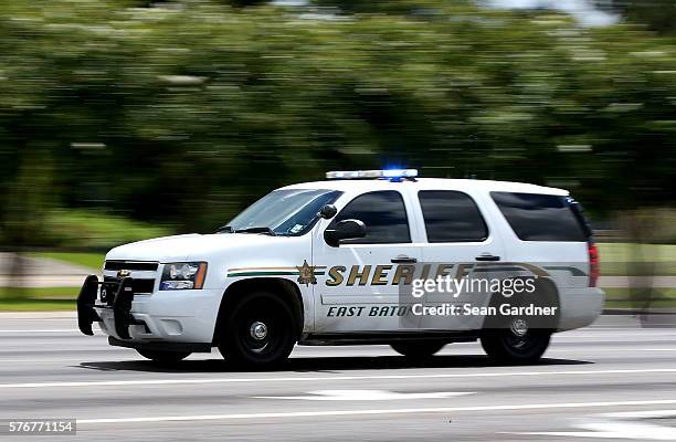 East Baton Rouge Police officers patrol Airline Hwy after 3 police officers were killed early this morning on July 17, 2016 in Baton Rouge,...