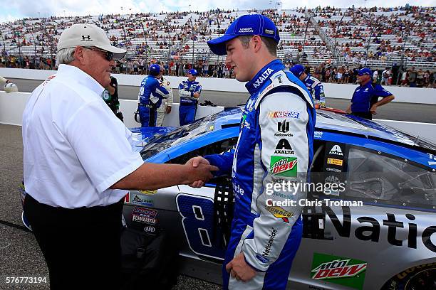 Alex Bowman, driver of the Nationwide Chevrolet, shakes hands with team owner Rick Hendrick prior to the NASCAR Sprint Cup Series New Hampshire 301...