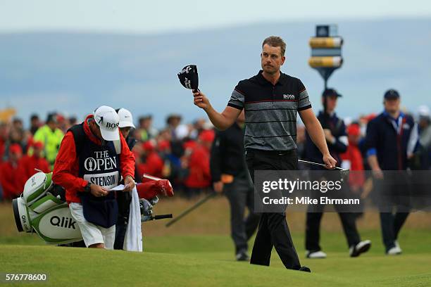 Henrik Stenson of Sweden acknowledges the crowd as he walks on the on the 18th hole during the final round on day four of the 145th Open Championship...