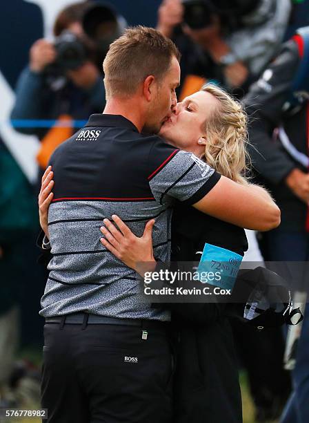 Henrik Stenson of Sweden kisses wife Emma in celebration after the winning putt on the 18th green during the final round on day four of the 145th...