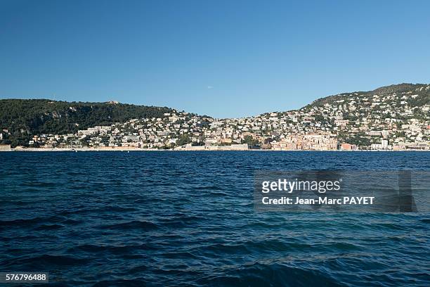 blue sea in front of saint-jean cap ferrat city - jean marc payet stock pictures, royalty-free photos & images
