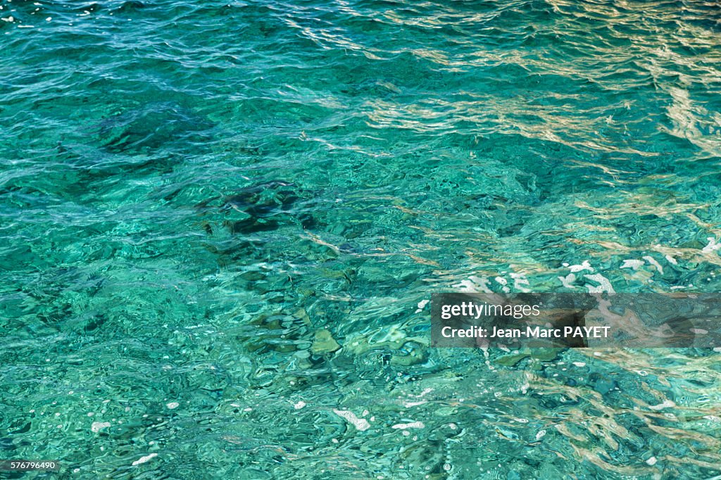 Reflection on blue sea