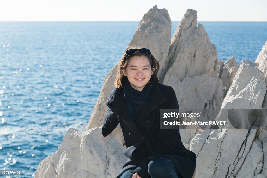 Asian girl on the rocks