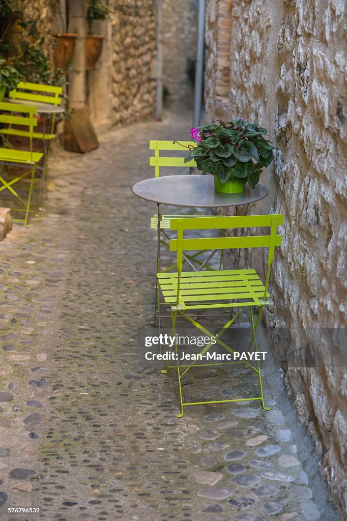 Chairs and tables on a typical village's street