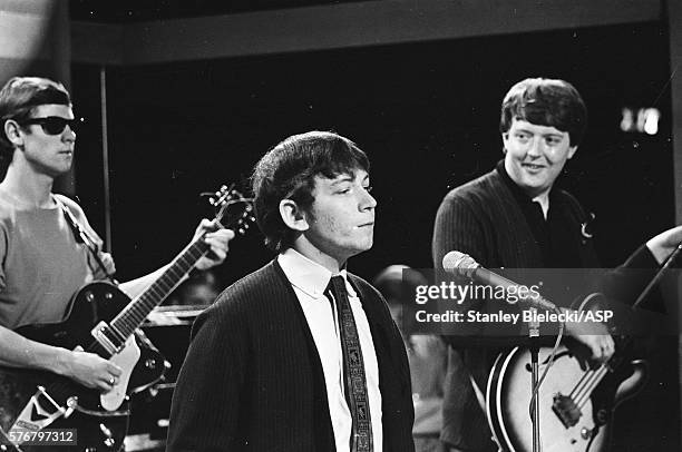 Hilton Valentine, Eric Burdon and Chas Chandler of The Animals appearing on a TV show, London, circa 1965.