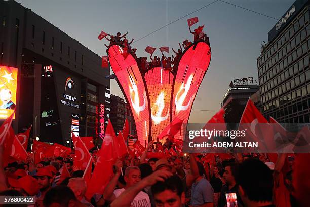 Pro-Erdogan supporters wait for Turkish President at Kizilay square in Ankara on July 17, 2016 during a demonstration in support to the Turkish...