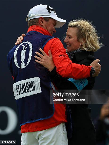 Caddie Garath Lord embraces Emma Stenson after Henrik Stenson of Sweden is victorious on the 18th green during the final round on day four of the...