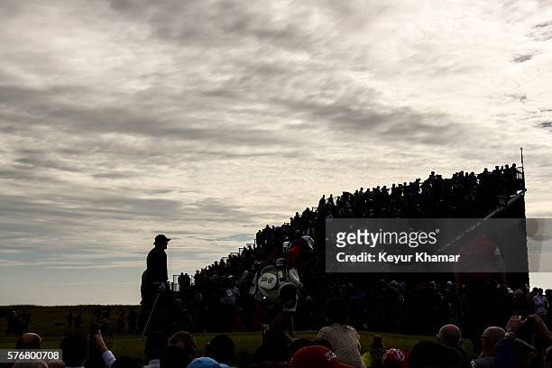 Fans watch as Phil Mickelson of the United States walks off the 16th hole tee box during the final round on day four of the 145th Open Championship...