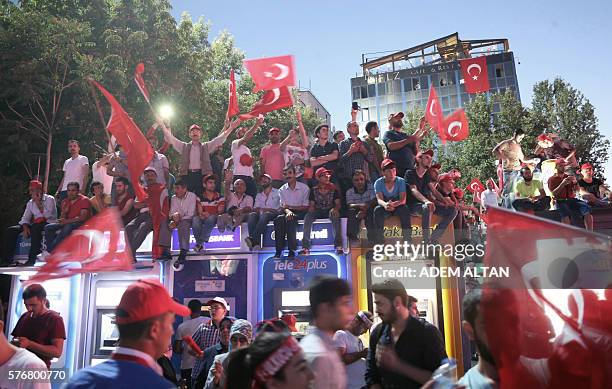 Pro-Erdogan supporters wave Turkish flags at Kizilay square in Ankara on July 17, 2016 during a demonstration in support to the Turkish government...