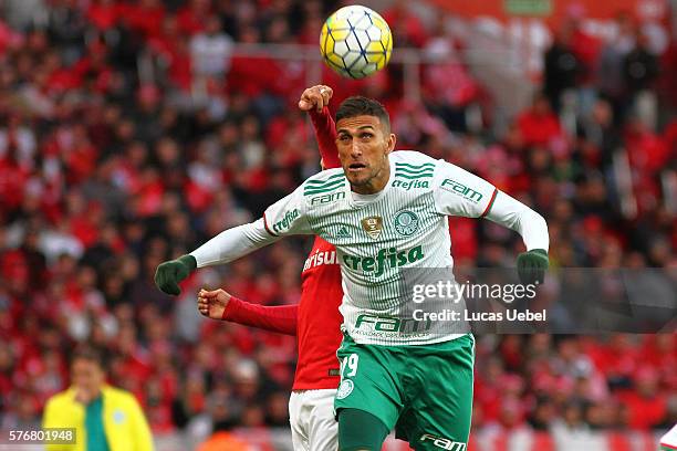 Paulao of Internacional battles for the ball against Rafael Marques of Palmeiras during the match between Internacional and Palmeiras as part of...