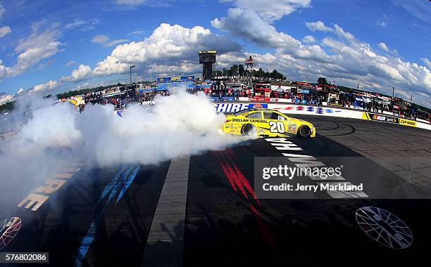 Matt Kenseth, driver of the Dollar General Toyota, celebrates with a burnout after winning the NASCAR Sprint Cup Series New Hampshire 301 at New...