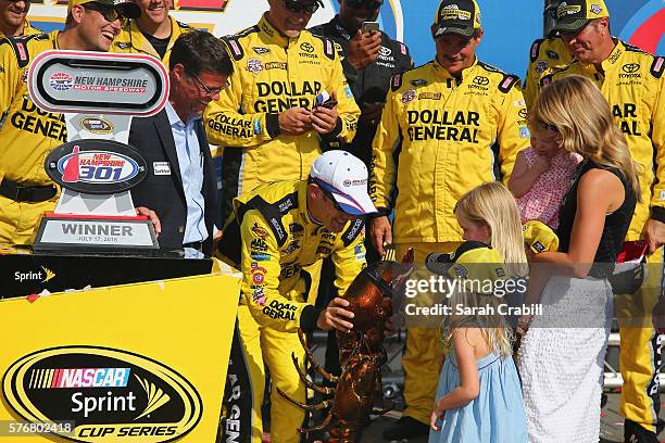 Matt Kenseth, driver of the Dollar General Toyota, celebrates in Victory Lane after winning the NASCAR Sprint Cup Series New Hampshire 301 at New...