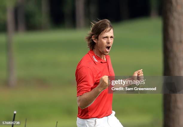 Aaron Baddeley of Australia celebrates after his putt on the fourth hole of the playoff to win against Si Woo Kim of Korea during the final round of...