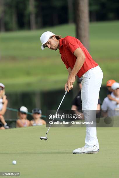 Aaron Baddeley of Australia putts on the fourth hole of the playoff against Si Woo Kim of Korea during the final round of the Barbasol Championship...