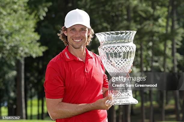 Aaron Baddeley of Australia poses with the trophy after winning during the final round of the Barbasol Championship at the Robert Trent Jones Golf...