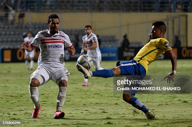 Zamalek's player Hazem Emam views for the ball Sundowns player Keagan Dolly during the African Champions League group stage football match between...