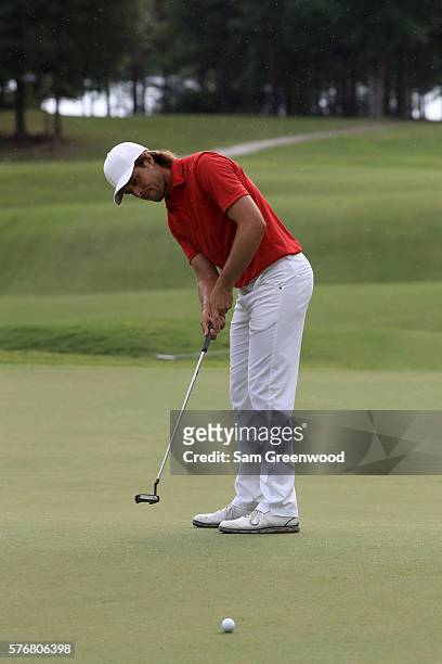 Aaron Baddeley of Australia putts on the first hole of the playoff against Si Woo Kim of Korea during the final round of the Barbasol Championship at...