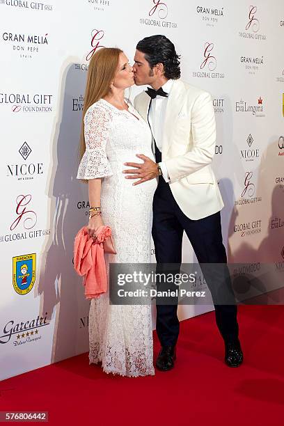 Olivia de Borbon and Julian Porras attend the Global Gift Gala 2016 red carpet at Gran Melia Don pepe Resort on July 17, 2016 in Marbella, Spain.