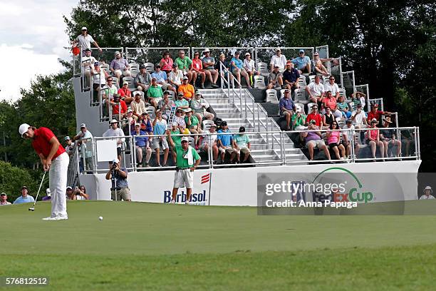 Aaron Baddeley of Australia putts on the fourth hole of the playoff against Si Woo Kim of Korea during the final round of the Barbasol Championship...