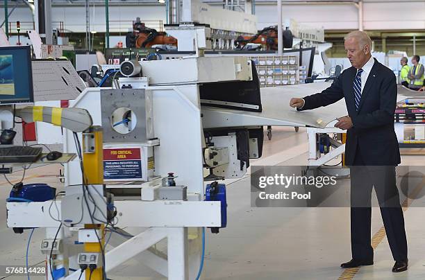 Vice President Joe Biden pretends to sign a wing component on a tour of the Boeing Aerostructures Australia's plant at Fishermans Bend on July 18,...