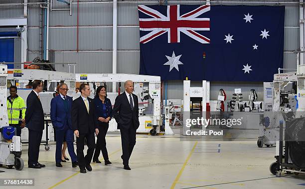 Vice President Joe Biden is hosted on a tour of the Boeing Aerostructures Australia's plant at Fishermans Bend by Mike Dickson managing director of...