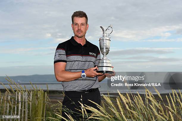 Henrik Stenson of Sweden poses with the Claret Jug on Troon Beach following his victory during the final round on day four of the 145th Open...