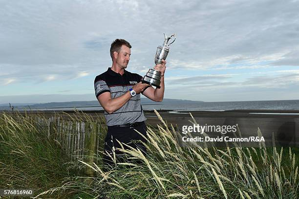 Henrik Stenson of Sweden poses with the Claret Jug on Troon Beach following his victory during the final round on day four of the 145th Open...