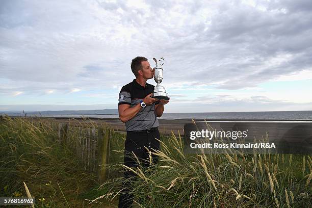 Henrik Stenson of Sweden poses with the Claret Jug on Troon Beach following his victory during the final round on day four of the 145th Open...