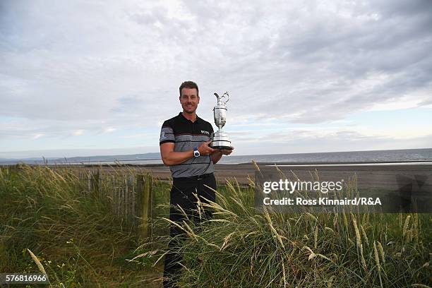 Henrik Stenson of Sweden poses with the Claret Jug on Troon Beach following his victory during the final round on day four of the 145th Open...