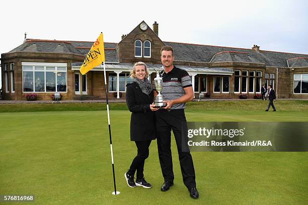 Henrik Stenson of Sweden poses with his wife Emma Stenson and the Claret Jug following his victory during the final round on day four of the 145th...