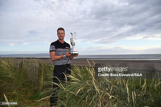 Henrik Stenson of Sweden poses with the Claret Jug on Troon Beach following his victory during the final round on day four of the 145th Open...