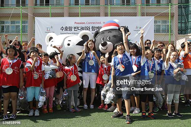 Pyeongchang Anticipates 2018 Winter Olympics mascots Soohorang and Bandabi and former figure skater Yuna Kim attend the press event to introduce the...