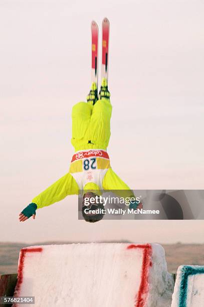 Freestyle skier doing a flip during competition at the 1988 Winter Olympics in Calgary.