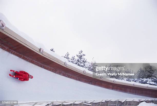 Two men ride their luge sled down the Sarajevo course during the 1984 Winter Olympic Games.