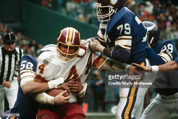 Washington Redskins running back John Riggins carries the ball against the Minnesota Vikings during the NFC Championship game.