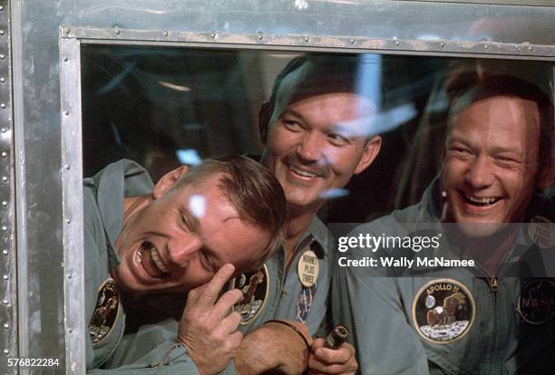 American heroes Neil Armstrong, Michael Collins, and Buzz Aldrin, the three astronauts who first landed on the moon, in quarantine aboard the USS...