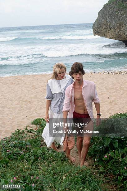 Mick Jagger and girlfriend Jerry Hall on the beach at Barbados, just prior to his 40th birthday.