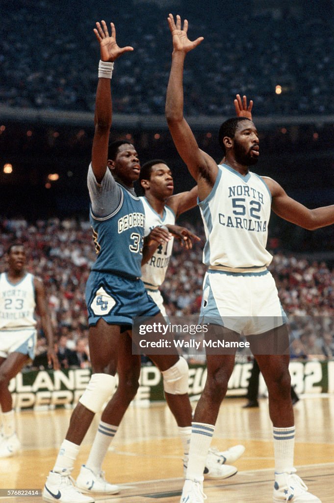 Sam Perkins and James Worthy Guard Patrick Ewing News Photo