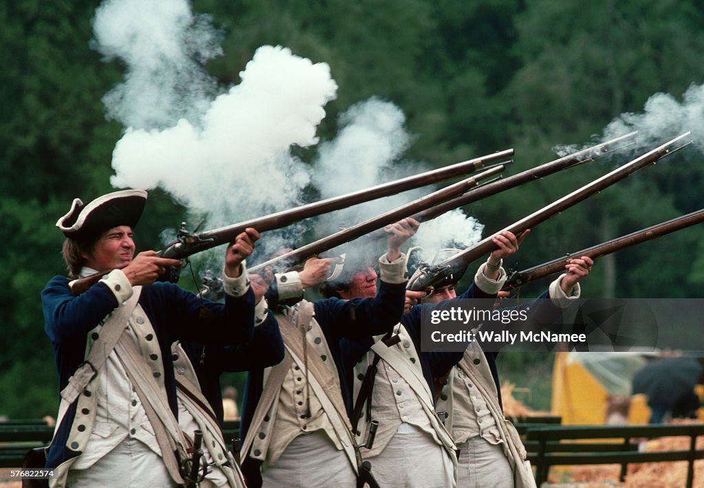 Minutemen Reenactors Shooting Rifles