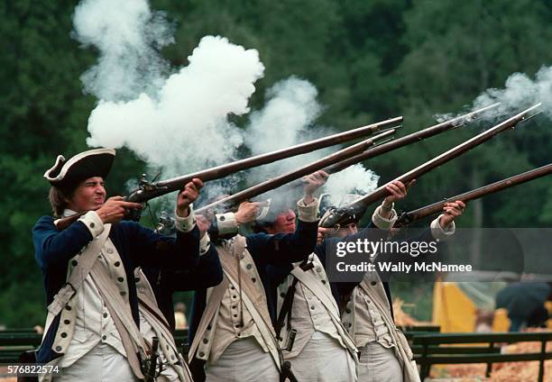 Minutemen Reenactors Shooting Rifles