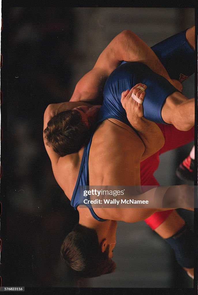 Kendall Cross holds Brad Penrith in a headlock during a wrestling ...